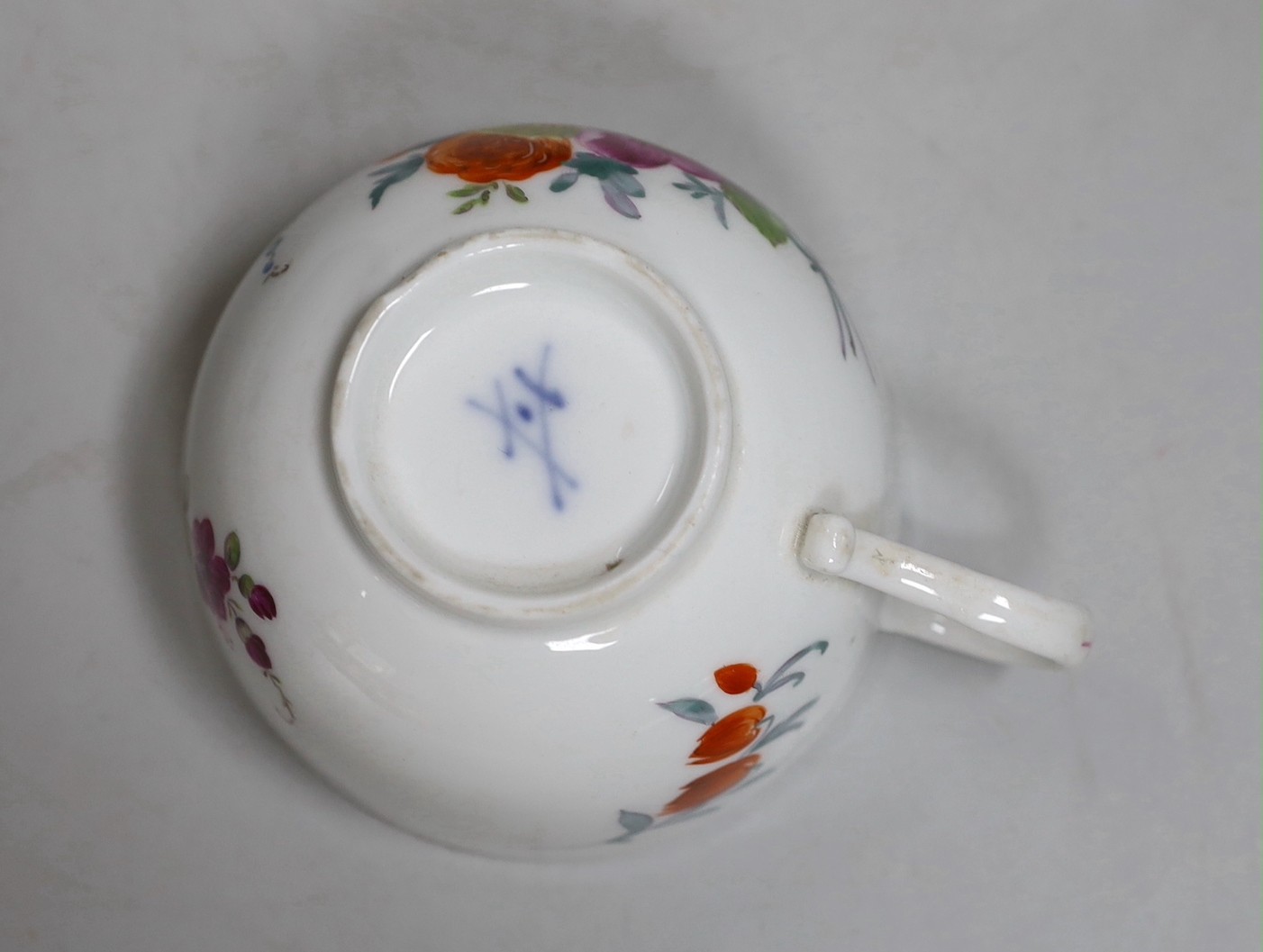 A Meissen dot period flower painted cup and saucer, c.1770